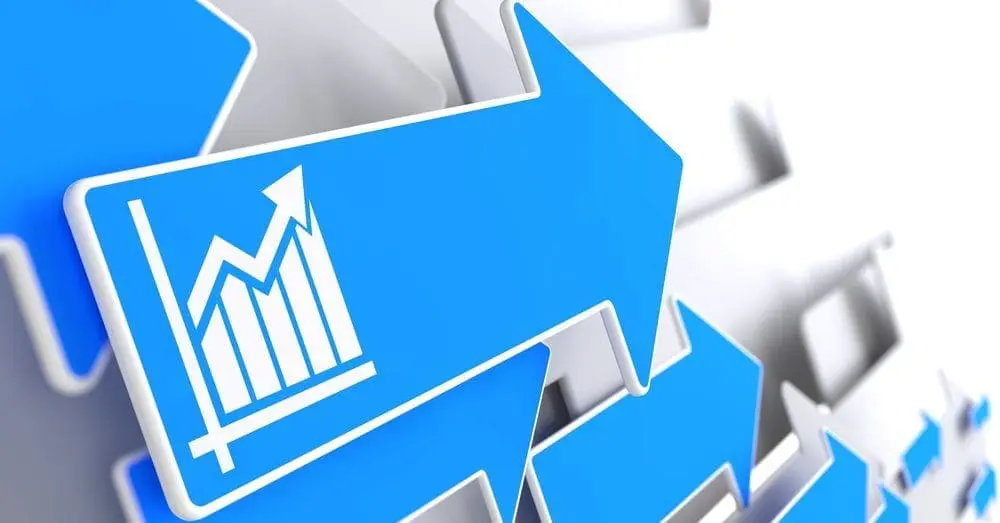Adherent (formerly Compliance & Risks). A 3D rendering of multiple blue arrows pointing upwards and to the right. The central arrow features a white line graph icon showing an upward trend and increasing bar charts.