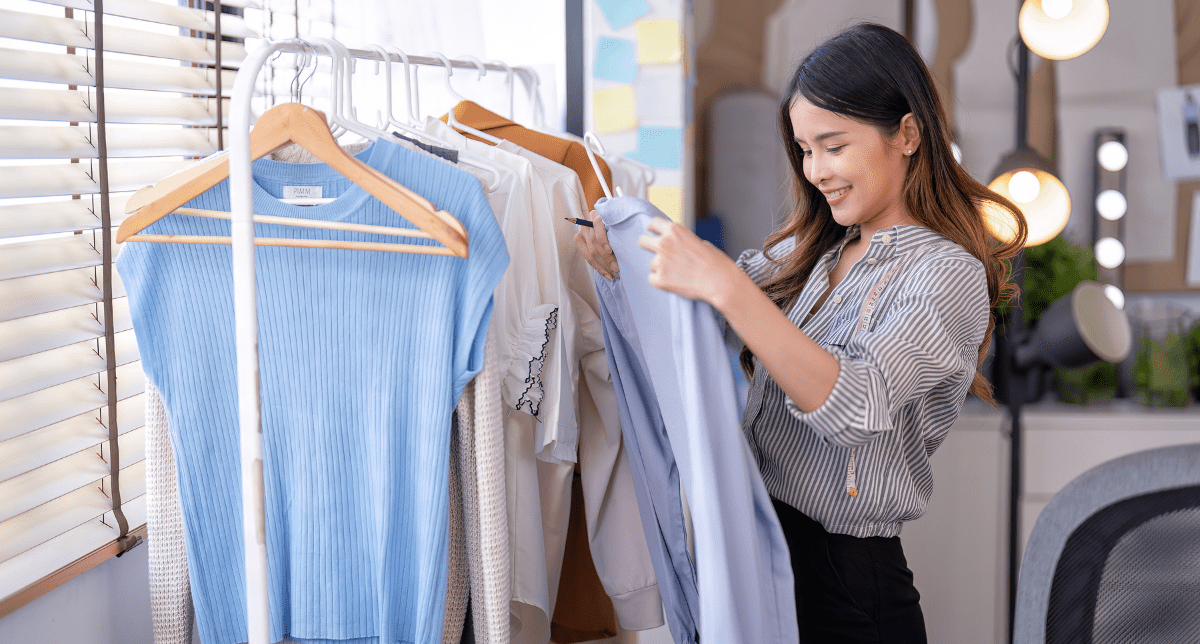 Fashion designer with clothes - concept for textiles regulations