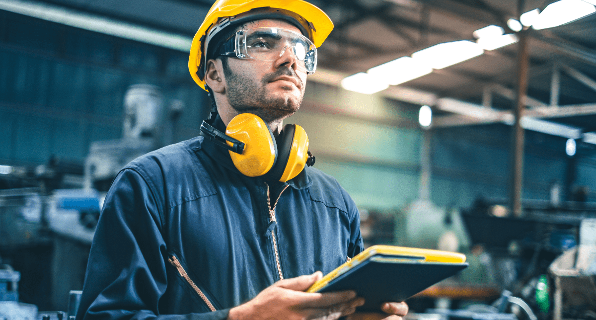 Adherent (formerly Compliance & Risks). Industrial engineer in hard hat - concept for EU Machinery Regulation