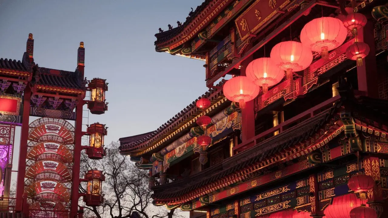 Adherent (formerly Compliance & Risks). Traditional Chinese buildings and an archway illuminated by numerous red lanterns against a dark blue sky at dusk.