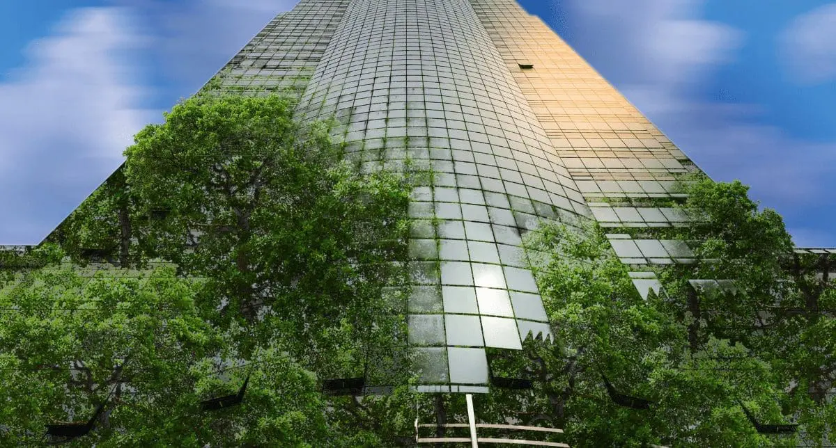 Adherent (formerly Compliance & Risks). A tall, modern glass skyscraper with green trees and foliage growing on its facade, set against a blue sky.
