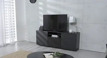 Adherent (formerly Compliance & Risks). A modern living room with a large flat-screen TV on a dark, textured media console, a round coffee table with a plant, and sheer white curtains.