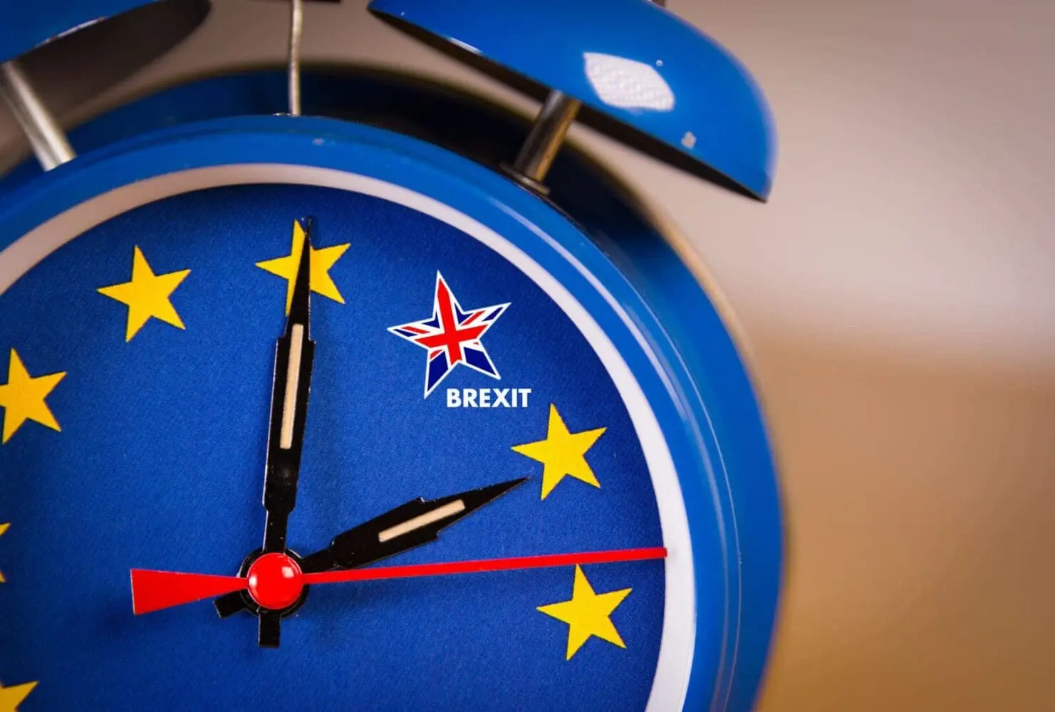 Adherent (formerly Compliance & Risks). A blue alarm clock with an EU flag face and a star containing the Union Jack and "BREXIT" text.