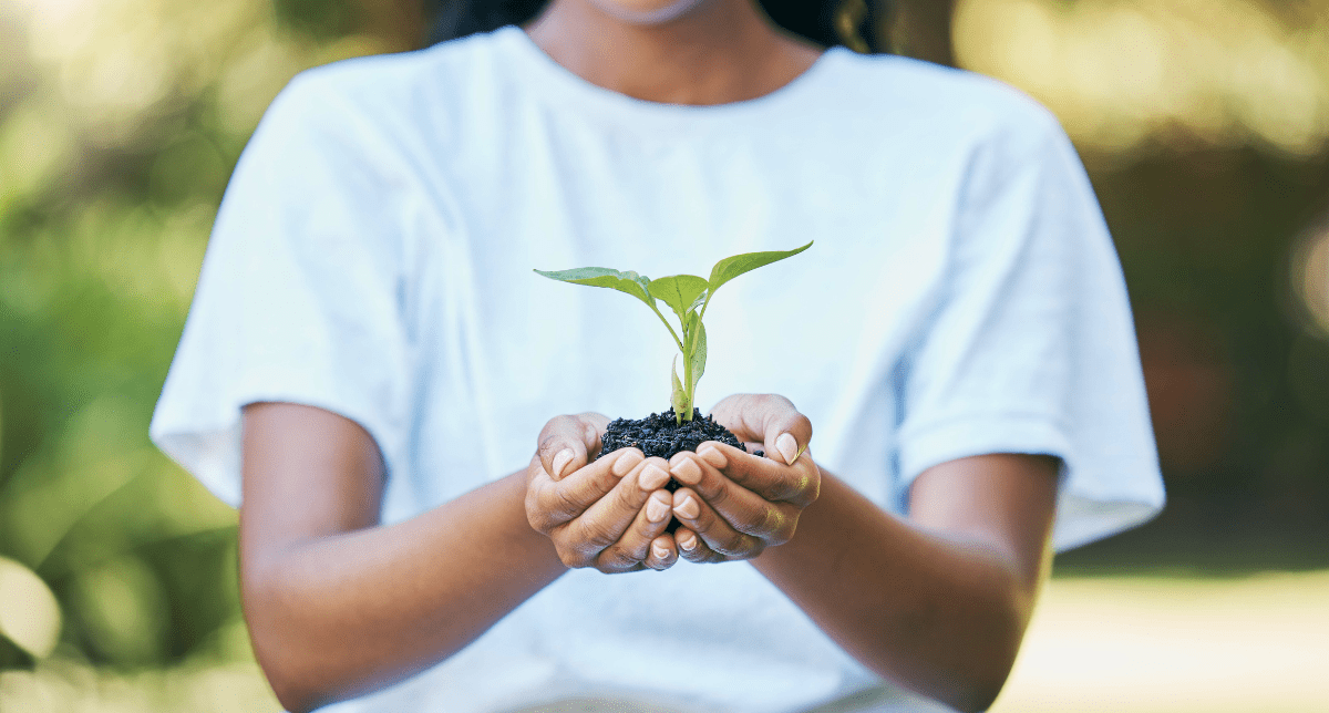 Adherent (formerly Compliance & Risks). Woman holding plant - concept for ESG regulatory developments