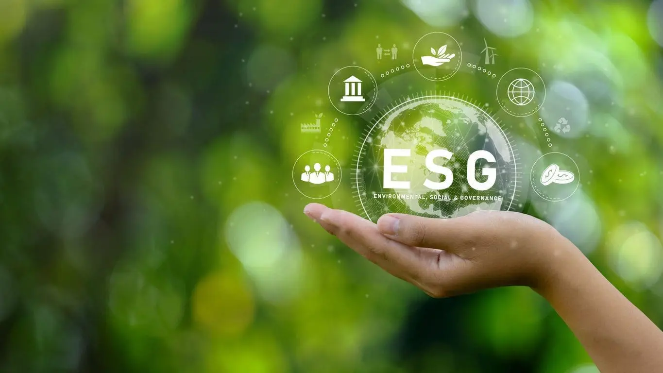 Adherent (formerly Compliance & Risks). A hand holding a holographic globe with 'ESG' and 'Environmental, Social & Governance' text, surrounded by icons representing environmental, social, and governance concepts, against a blurred green background.