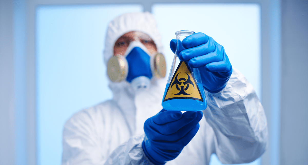Adherent (formerly Compliance & Risks). scientist holding toxic substance- concept for Regulatory Developments on Hazardous Substances