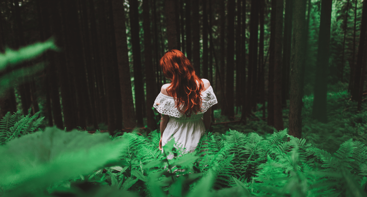 Adherent (formerly Compliance & Risks). woman in dress in forest - concept for Textiles EPR