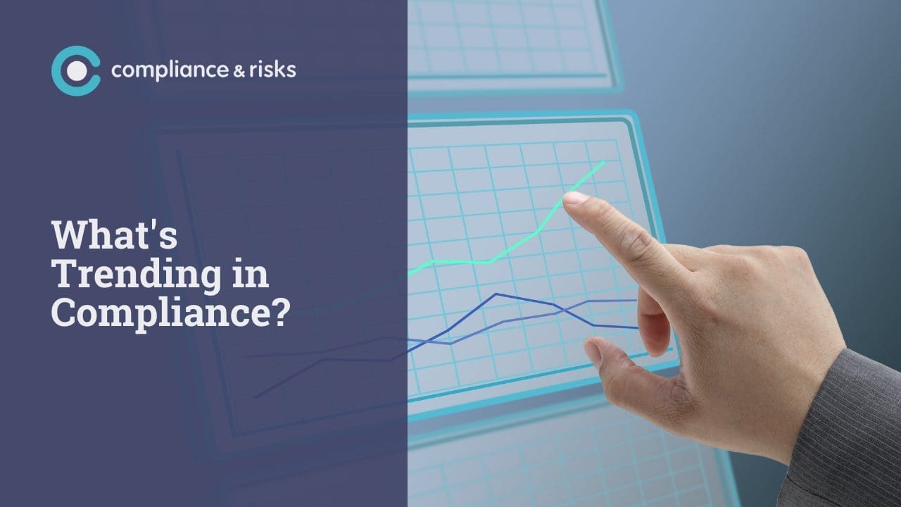 A hand pointing at an upward trending green line on a digital graph, next to the text 'What's Trending in Compliance?' and the 'compliance & risks' logo.