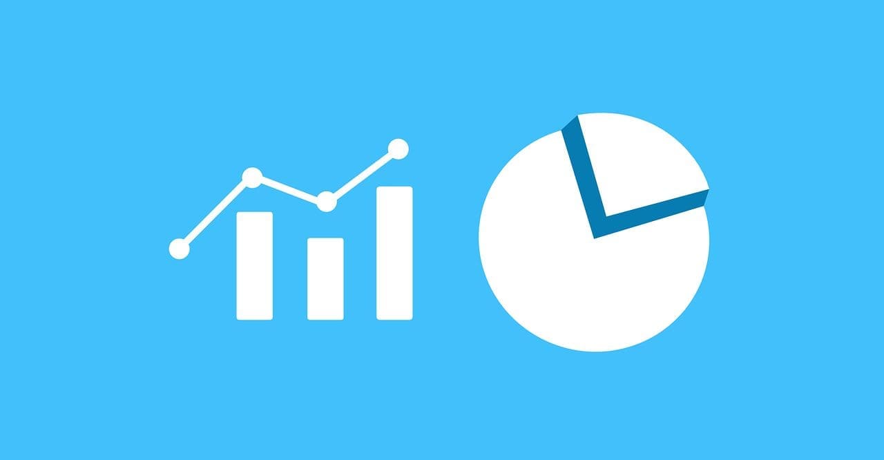 A white bar chart, line graph, and pie chart on a light blue background, representing data visualization.