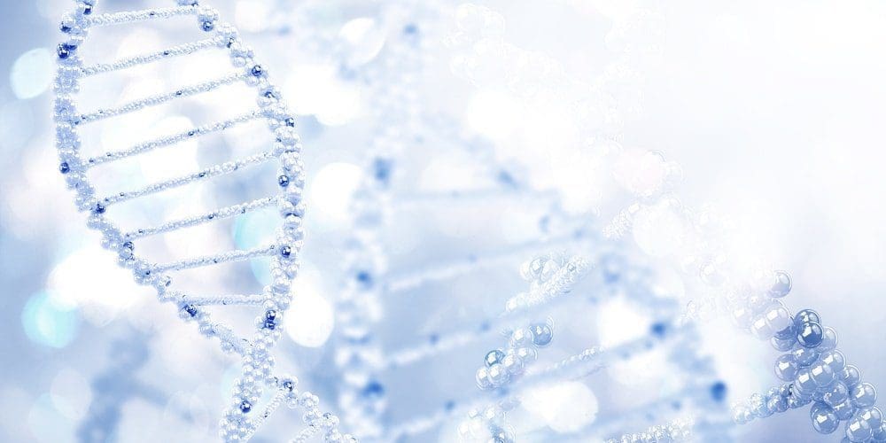 A stylized, shiny blue and white DNA double helix structure against a blurred, light blue background with bokeh lights.