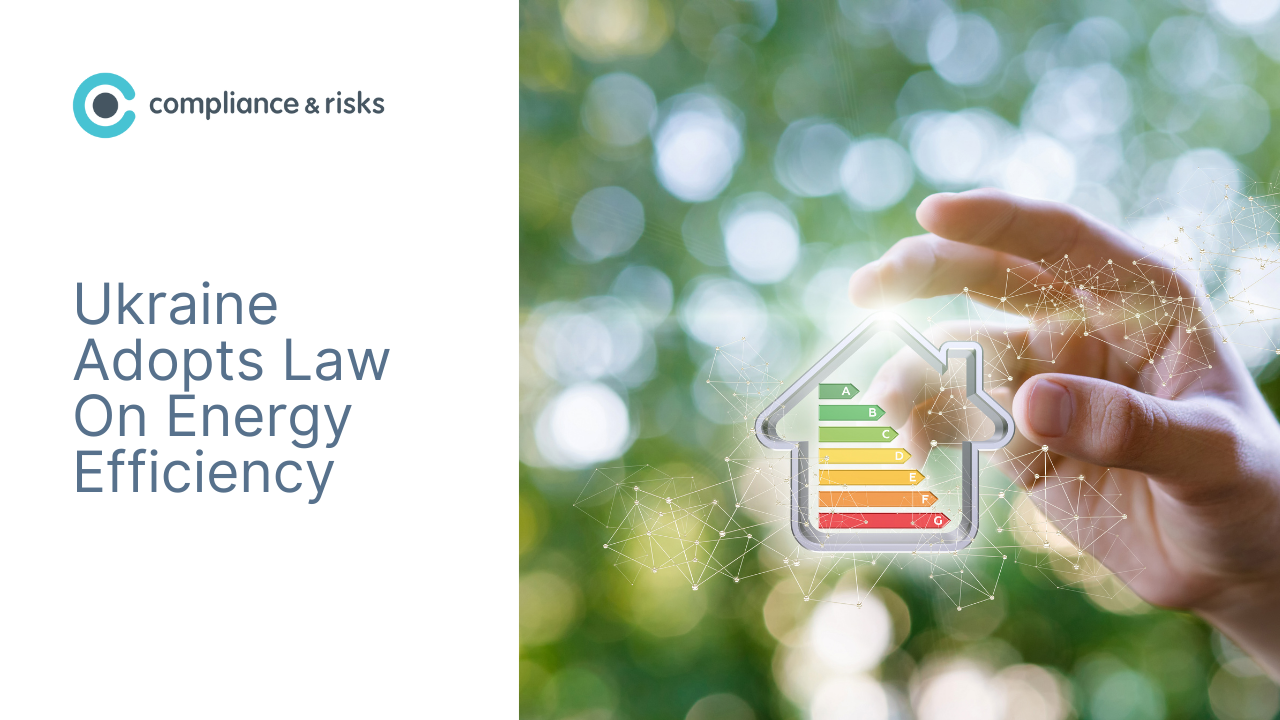 Adherent (formerly Compliance & Risks). A hand reaching towards a glowing house outline with an energy efficiency label inside, against a blurred green background. Text reads 'Ukraine Adopts Law On Energy Efficiency' with 'compliance & risks' logo.
