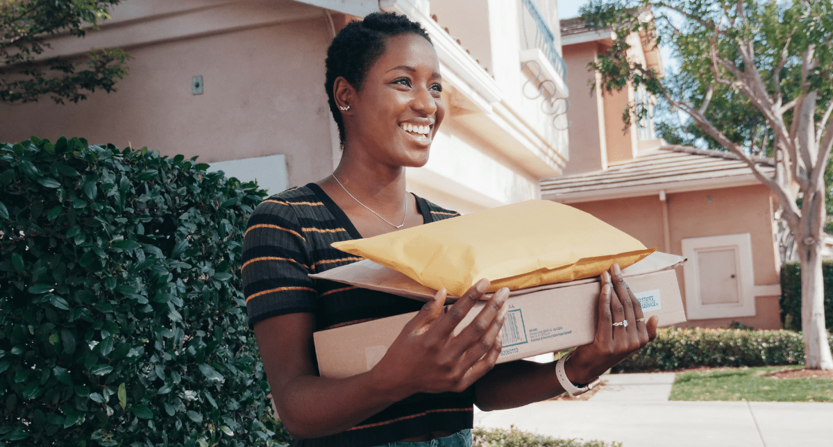 Woman holding packages - concept for Global Packaging EPR Reporting Requirements