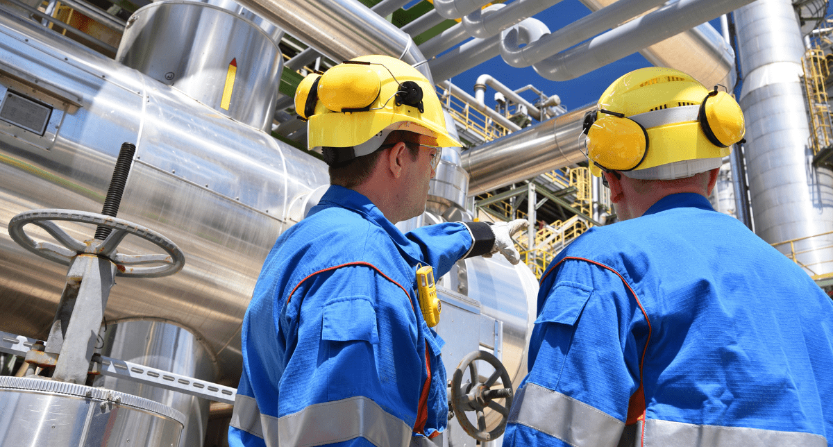 Industrial workers with industrial machinery - industrial machinery regulation