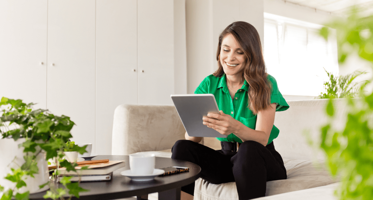 Woman on tablet working in eco-friendly office - concept for Ecodesign for Sustainable Products Regulation (ESPR)