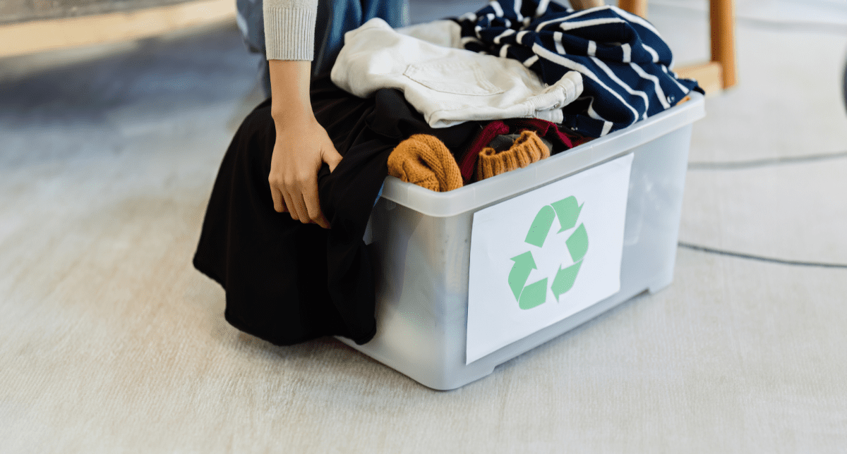 Woman recycling clothes - concept for Re-Viste Textiles Waste Collection Pilot in Spain
