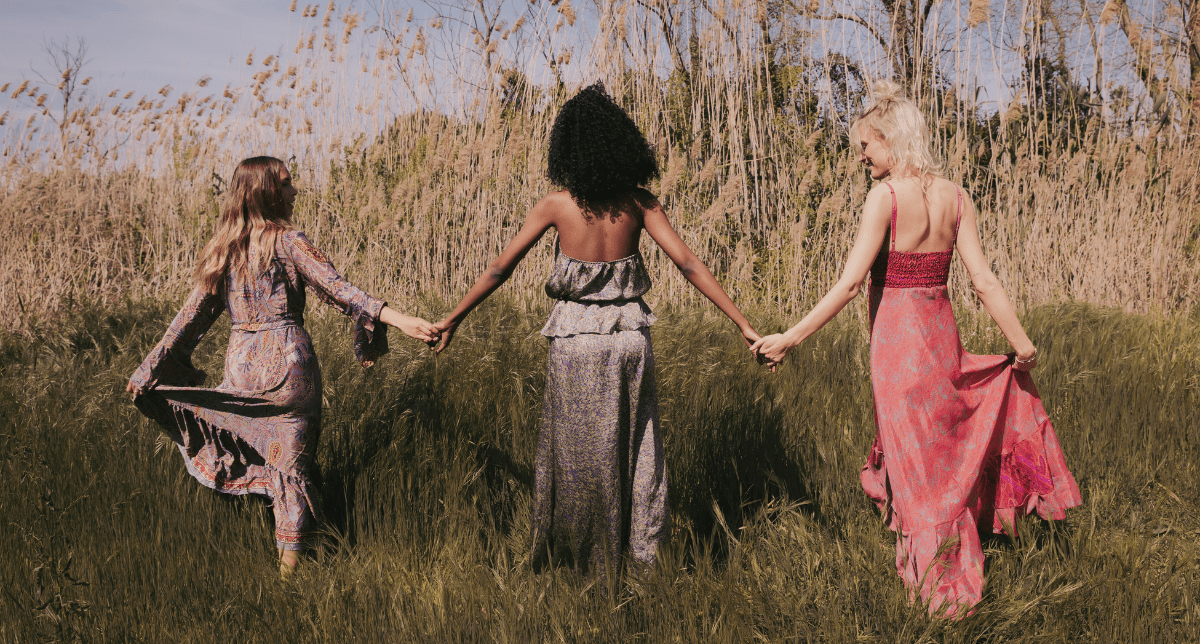 Women wearing dresses walking outdoors - concept for Italian textile EPR