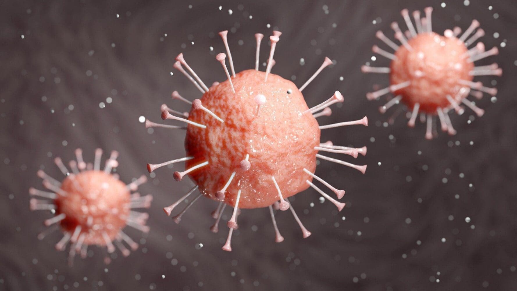 Three pinkish-orange virus-like particles with spikes, rendered in 3D, against a dark, speckled background.