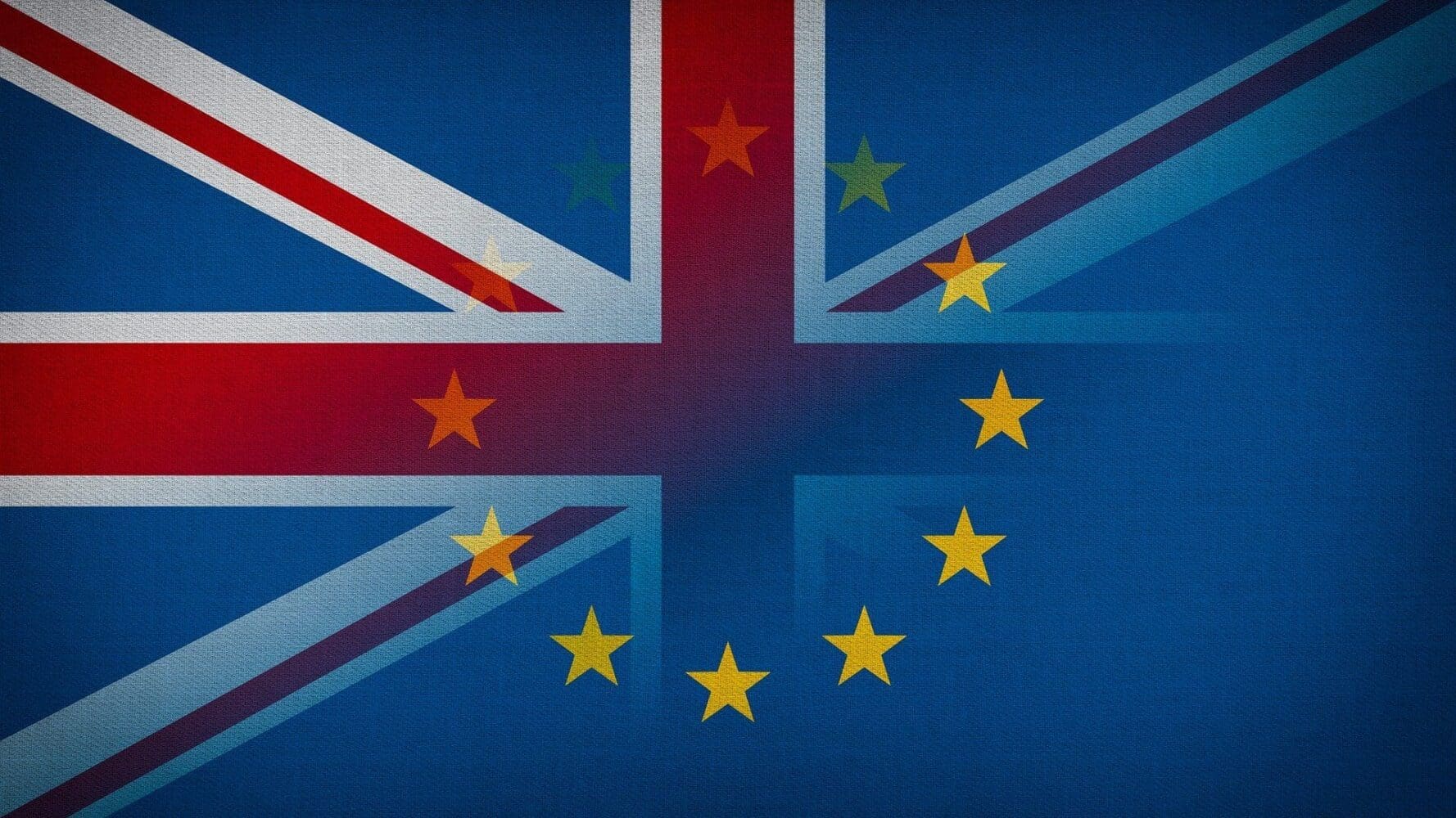A blended image of the Union Jack and the European Union flag, showing an overlap of their designs.