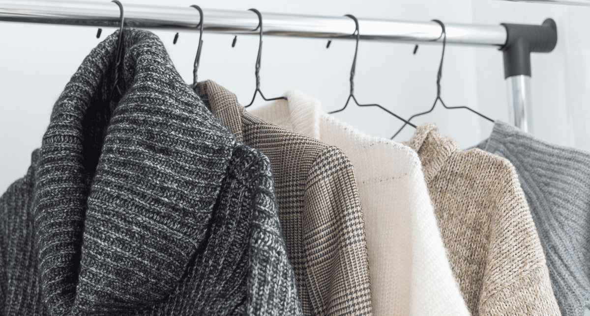 knitwear hanging on clothes rack - concept for Extended Producer Responsibility for Textiles