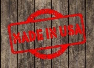 Red 'MADE IN USA' stamp on a wooden background.