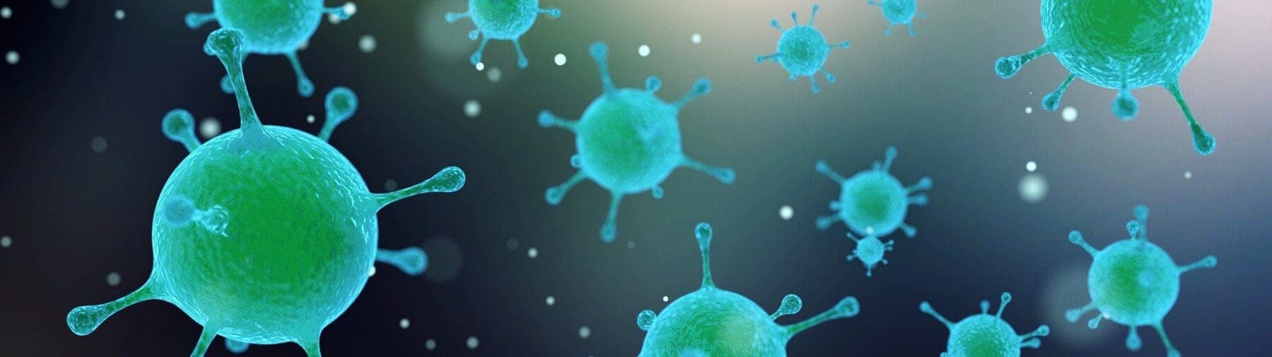 Microscopic image of green, spiky spherical organisms resembling viruses or bacteria, against a dark, blurry background with white dots.