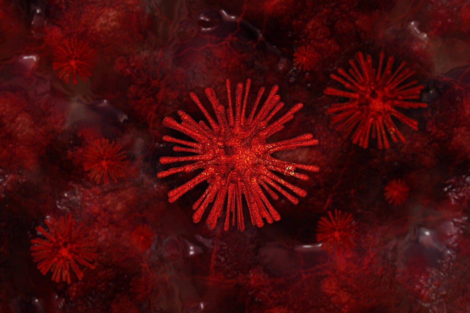 Microscopic image of multiple red, spiky spherical structures resembling viruses or bacteria against a dark red, textured background.